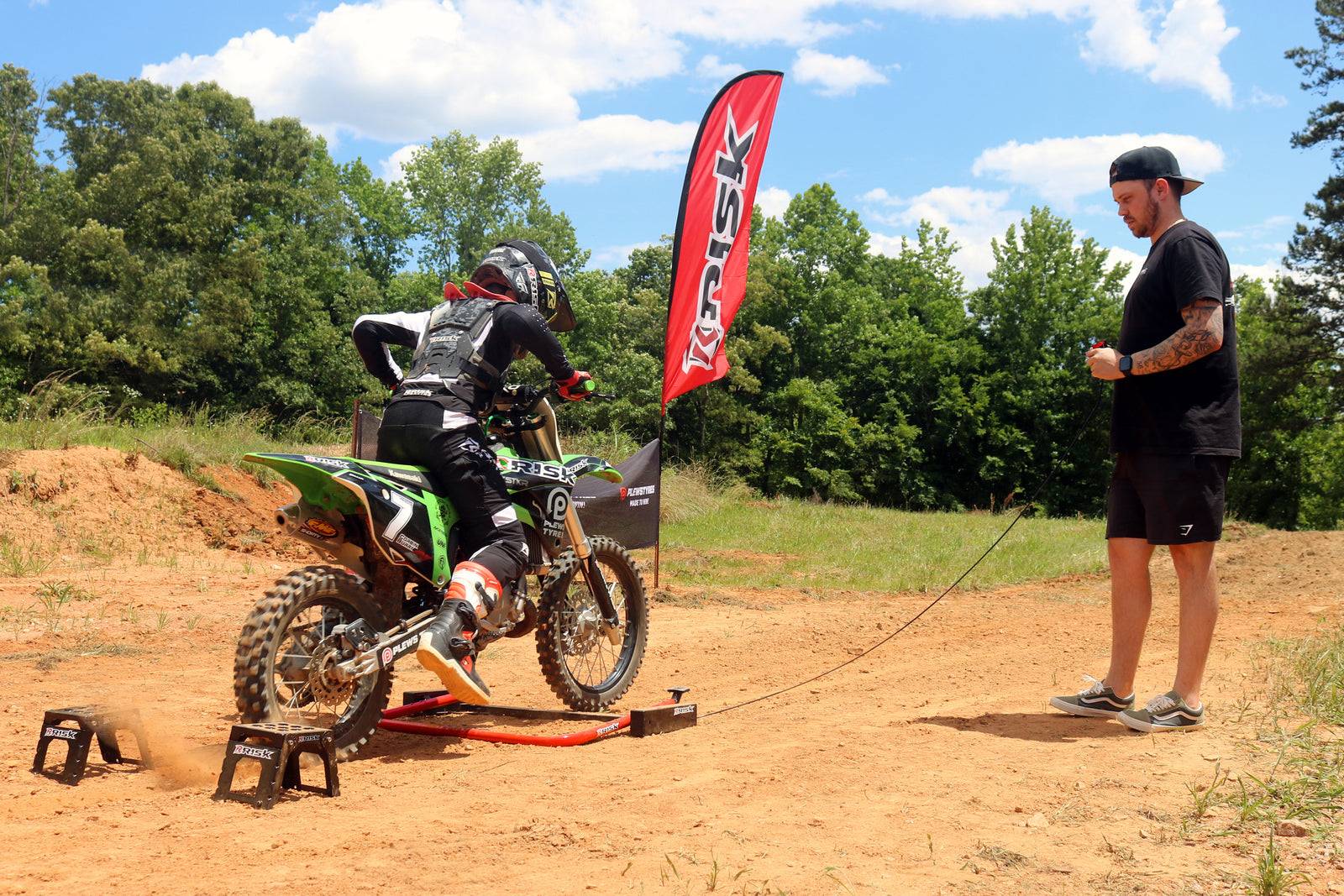 Youth racer practicing his starts with a trainer using a Holeshot Manual Starting Gate
