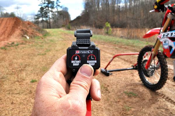PRO Holeshot Starting Gate Trainer Remote in hand